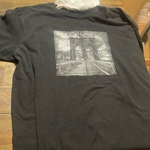 black tee size medium with a picture on it
